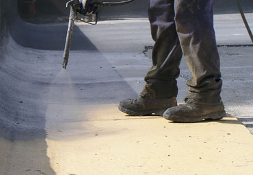 Coating systems over Concord spray foam roof systems
